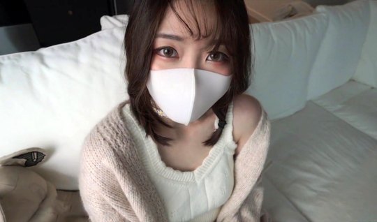 Masked Asian girl spreads her legs for homemade porn with a fan in the apartment
